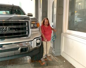 Whoa! A five-foot-two, cane using elderly woman, a cousin of the author, is no match for this monster GMC truck parked on a sidewalk in New Orleans. Photo: Martha Roskowski