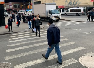 Everyone jaywalks but mostly only Blacks and Latinos are charged. Photo: Gersh Kuntzman