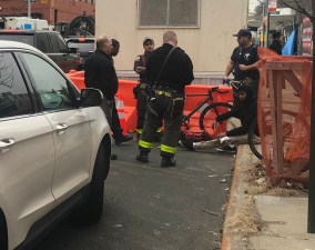 The cyclist was treated by EMTs, but requested transport to an area hospital after being hit by a driver on Flushing Avenue. Photo: Julianne Cuba