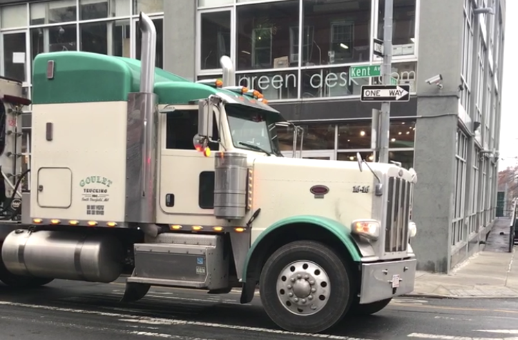Hey, idling polluters! An army of empowered citizens is coming to report you! Above, an idling truck on Kent Avenue in Brooklyn. Photo: Lael Goodman