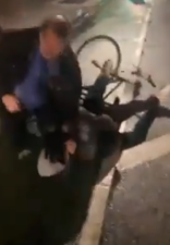 An armed security guard tackles a random cyclist in the Sixth Avenue bike lane on Tuesday night. Video: Vincenzo Tran