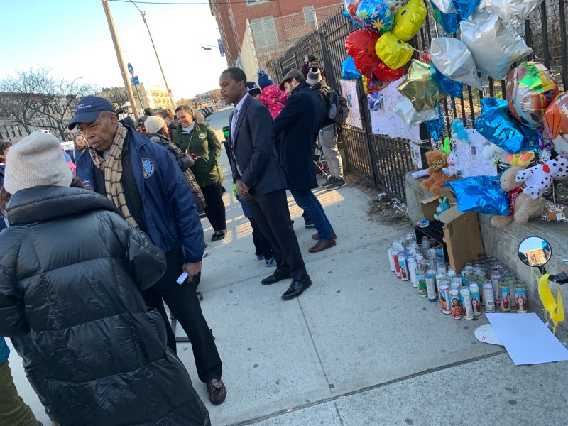 Brooklyn Borough President Eric Adams stands near candles honoring Payson Lott, one of two school-age kids killed last week in East New York. Photo: Gersh Kuntzman