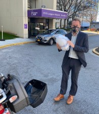 Special delivery! A doctor at NYU-Langone with a PAPR helmet dropped off by a NYC ADV volunteer. Photo: Mario Notton