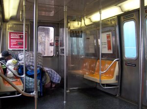 A homeless woman sleeps on the subway. Photo: lennyzgrl via flickr.com