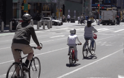 Is that a KID biking in Times Square? Why not? Photo: Clarence Eckerson Jr.