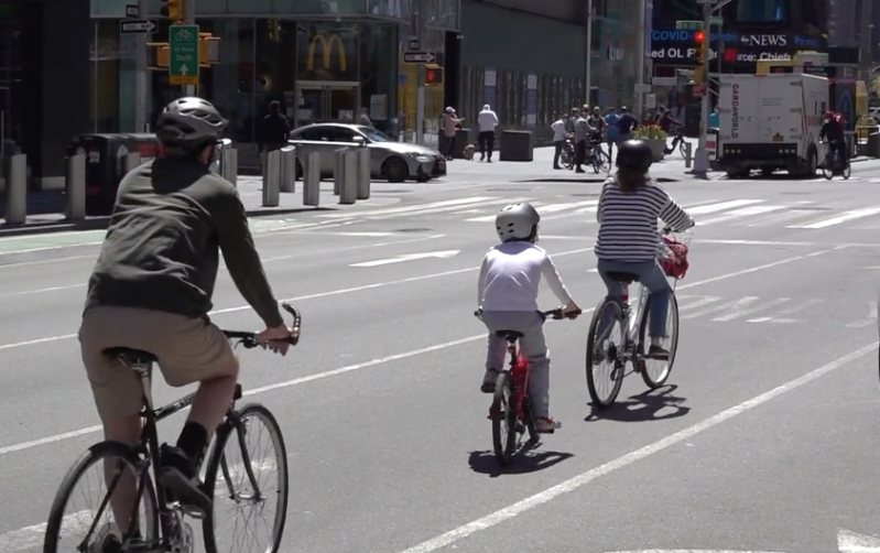 Is that a KID biking in Times Square? Why not? Photo: Clarence Eckerson Jr.
