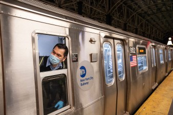 A worker cleaned a train as the MTA began its overnight closures on May 6. 
Photo: Patrick Cashin / Metropolitan Transportation Authority
