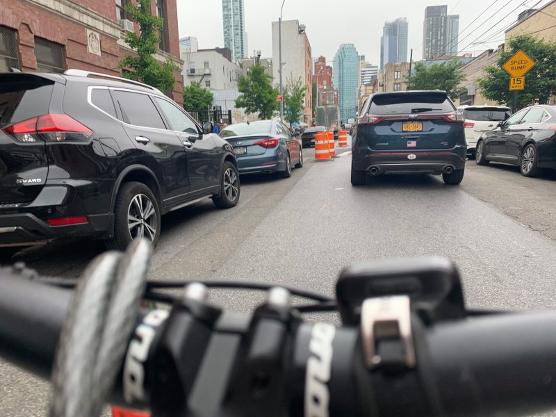 As with any temporary protected bike lane, the protection is only as good as drivers' adherence to the rules. Photo: Gersh Kuntzman
