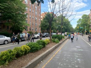 In Jackson Heights, residents are using the 34th Avenue open street exactly as designed: for safe, socially responsible recreation. Photo: Gersh Kuntzman