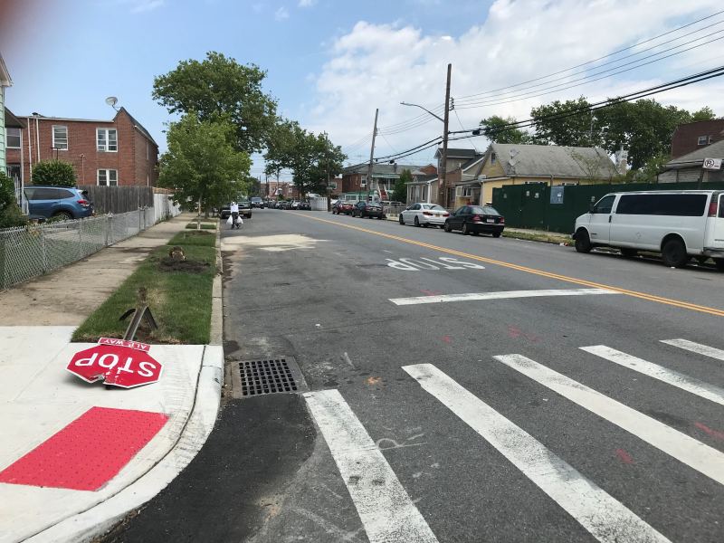 A hit-and-run driver killed a man at the corner of Avenue N and E. 98th Street in Canarsie. Above, a downed stop sign and fire hydrant show the driver's path. Photo: Steven Vago