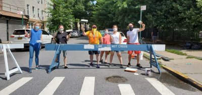 Volunteers who recently came out to beautify open street barricades on Driggs Avenue. Photo: North Brooklyn Open Streets Community Coalition
