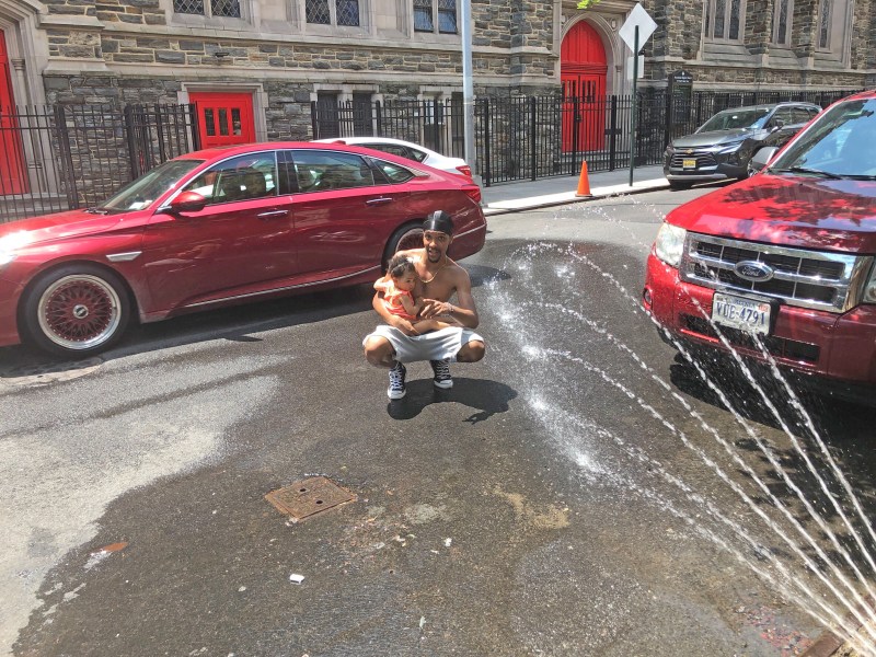 Tykwan and Nala Reid tried to enjoy a "cool street" on W. 138th St., but cars kept getting in the way. Photo: Adam Light