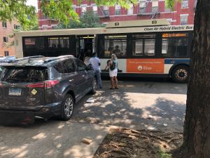 Yes, Harlem residents are still forced into the street because their bus can't get to the curb. Photo: Adam Light