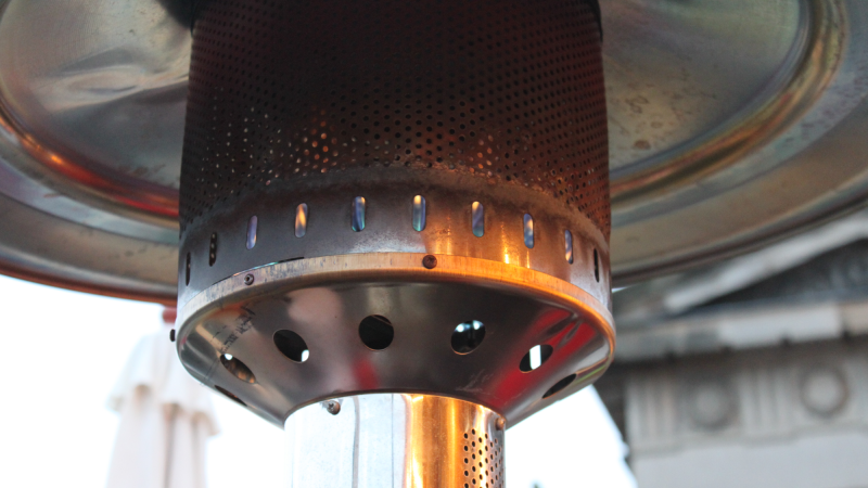 A propane lamp will warm you during your outdoor meal, but it will also warm up the planet. Photo: Mark Longair via Flickr