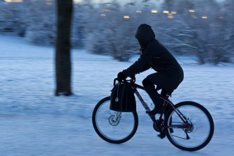 A cyclist rides through the harsh Oslo winter, which means that you can too. Photo: Eric Solheim via Flickr