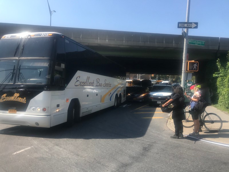 An Excellent Bus Service bus turns through the same intersection on Tuesday. Photo: Julianne Cuba
