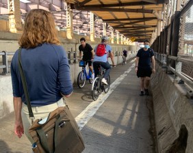 Congestion on the Queensboro Bridge's lone cyclist and pedestrian path  is especially egregious given how much space the city allocates for cars on the same span. File photo: Gersh Kuntzman