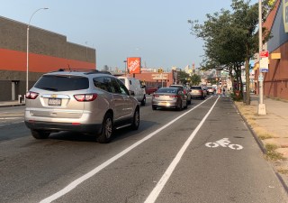 The temporary bike lane on Northern Boulevard (after it lost all its temporary delineators during snow removal operations). File photo: Gersh Kuntzman