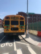 A school bus parked in the bike lane on Wythe Avenue a day after cyclist, Sarah Pitts, was killed here. Photo: Julianne Cuba