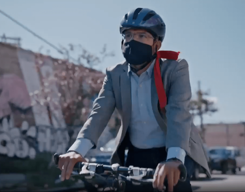Council Member and would-be mayor Carlos Menchaca on a bike. Photo: Menchaca campaign