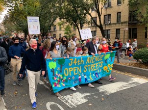 A few hundred people, marching behind a nice handmade banner, demanded permanence for the 34th Avenue open street on Saturday. File photo: Gersh Kuntzman