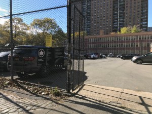 Cops from the 88th Precinct have again seized space in Classon Playground for private car storage. Photo: Julianne Cuba