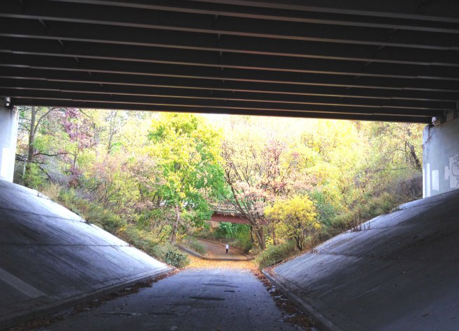 The Vanderbilt Motor Parkway, formerly a road but now a bike and foot path, as it crosses under the Grand Central Parkway. Activists are seeking to connect all parks in Eastern Queens with similar greenways. Photo: EdisonKoo.com