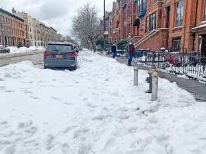 More than 36 hours after the storm ended, this is what many protected bike lanes look like. Photo: Gersh Kuntzman