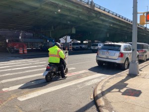 A moped rider uses Third Avenue. File photo: Julianne Cuba