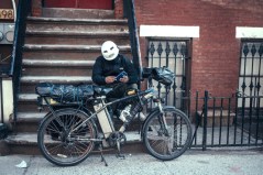 A delivery worker with his e-bike and multiple batteries. File photo