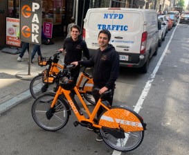 The offending photo: The Jonathan Cohens behind JOCO (New York Cohen, left, London Cohen, right) show off their bike on W. 36th Street. Photo: Gersh Kuntzman