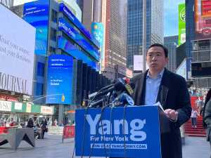 Mayoral wannabe Andrew Yang speaking in Times Square in Sunday, one day after a shooting. Photo: Christopher Robbins