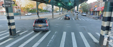 White Plains Road at 216th Street, where the city plans to build a protected bike lane under the elevated. Source: Google Maps