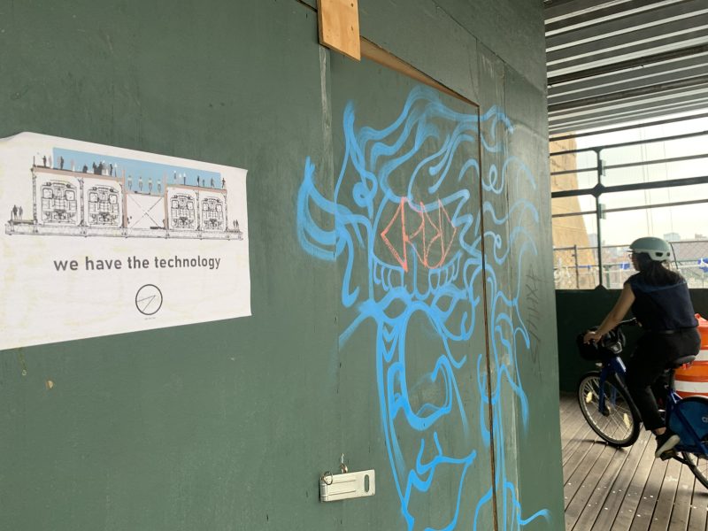 Someone pasted posters on the Brooklyn Bridge reminding the Department of Transportation that our bridges used to be more useful ... before cars. Photo: Gersh Kuntzman