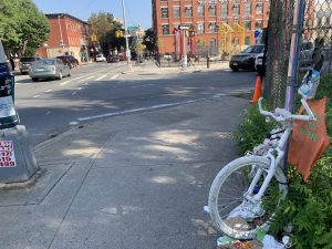 Sarah Pitts's ghost bike is in the foreground. The scene of her death is in the background. Photo: Gersh Kuntzman