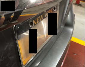 An illegal license plate cover on the back plate of an MTA employee who avoided paying tolls for years. Photo: MTA Inspector General's Office