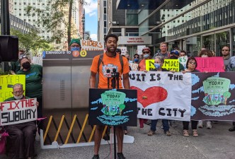 Patrick Houston from New York Communities for Change was one of many congestion pricing supporters rallying on Sunday at Gov. Hochul's office. Photo: Riders Alliance