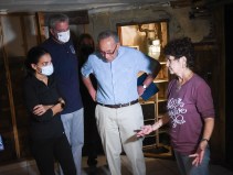 (from left) Alexandria Ocasio-Cortez, Mayor de Blasio and Sen. Chuck Schumer talk to a Queens flood victim. Photo: Michael Appleton / Mayoral Photography Office