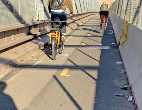 Garbage lane? Sometimes the new Brooklyn Bridge bike path is full of trash. Photo: Gersh Kuntzman