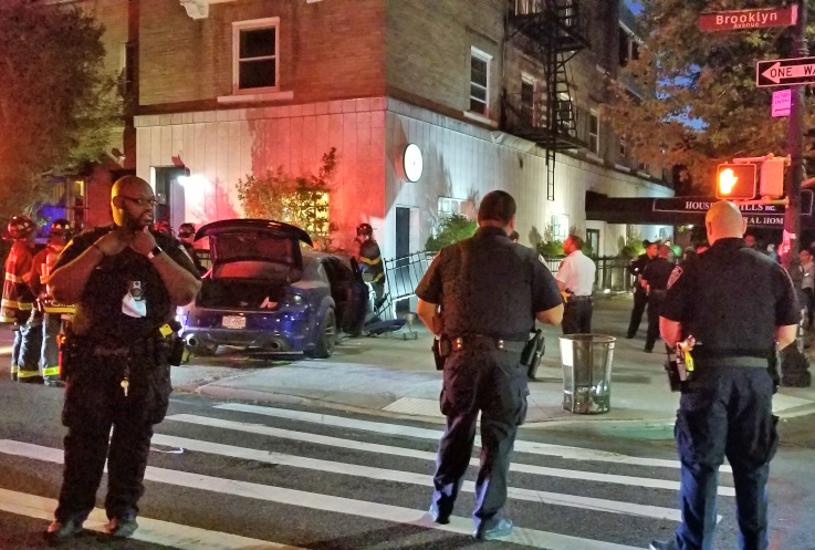 The blue Dodge Charger after it plowed into a Crown Heights funeral home Tuesday night. Photo: Shmuli Evers