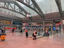 Passengers standing around the main waiting area at Moynihan Station, because they can't sit. Photo: Dave Colon