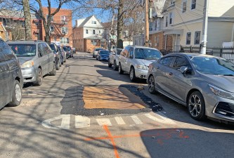 The city covered over a sunken part of 40th Drive in Queens on Friday — but only after a cyclist was killed after failing into the depressed roadway. Photo: Gersh Kuntzman