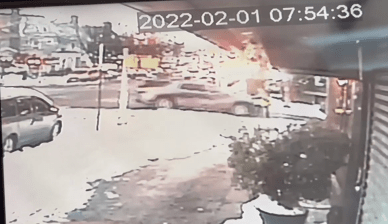 A video still shows a driver running over a woman in Brooklyn.