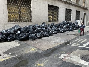 Garbage bags clutter a sidewalk in the Financial District. File Photo