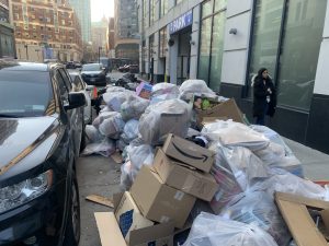 Welcome to New York, where pedestrians walk amid leaking, stinking garbage bags.