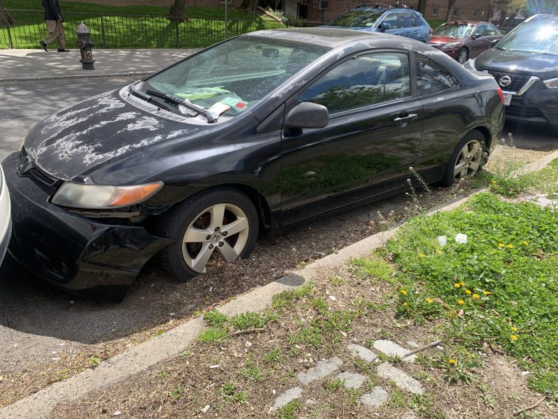 Will this abandoned car on Ocean Parkway ever be removed? Photo: Gersh Kuntzman