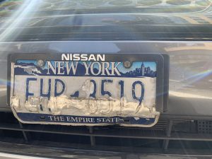 A defaced plate (one of several!) that we spotted in an NYPD parking space at the 84th Precinct in Downtown Brooklyn.