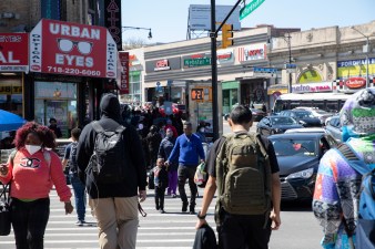 Students navigate busy street traffic at the corner of East Fordham Road and Webster Avenue in the Bronx, New York on May 9, 2022. Photo: Bess Adler