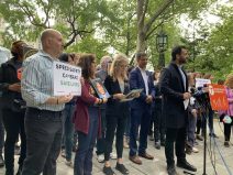 Transportation Alternatives' Danny Harris (with Assembly Member Harvey Epstein, far right) rallied for speed cameras. Photo: Gersh Kuntzman