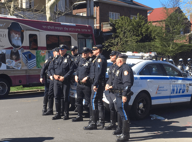NYPD officers in Brooklyn. Cops who live outside the city often act like an occupying force, State Sen. Kevin Parker writes. Photo: AdmiralHalseyy via Wikimedia Commons